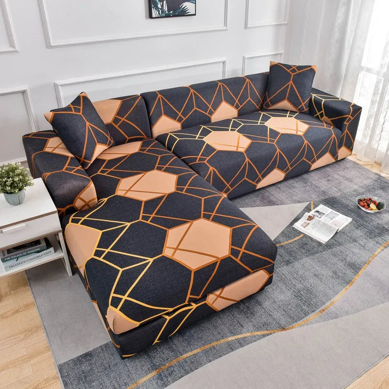 L-shaped sofa protector covers featuring a dark blue and orange geometric pattern on a gray rug.