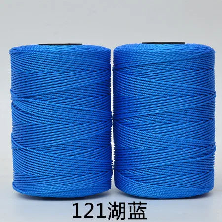 Two spools of bright blue hand knitting and crochet cord for crafting