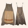 A sleeveless olive green apron with a rectangular tan pocket detail.