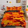 A vibrant camouflage duvet cover set featuring orange, yellow, and red patterns displayed on a bed.