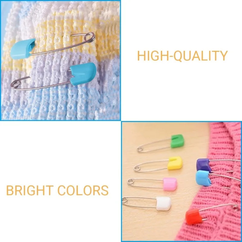 A close-up of stainless steel diaper pins in bright colors with safety locking closures against a white background.