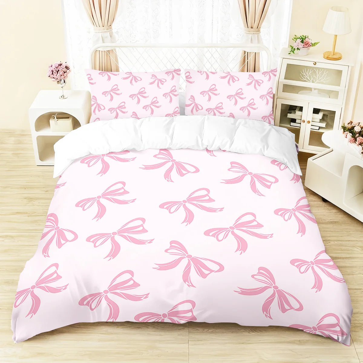 Pink bedding set featuring a butterfly pattern on a duvet cover and pillows.