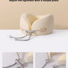 Adjustable snap closure for neck size on a beige memory foam travel neck pillow