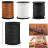 A set of heavy duty nylon upholstery thread spools in brown, white, and black.
