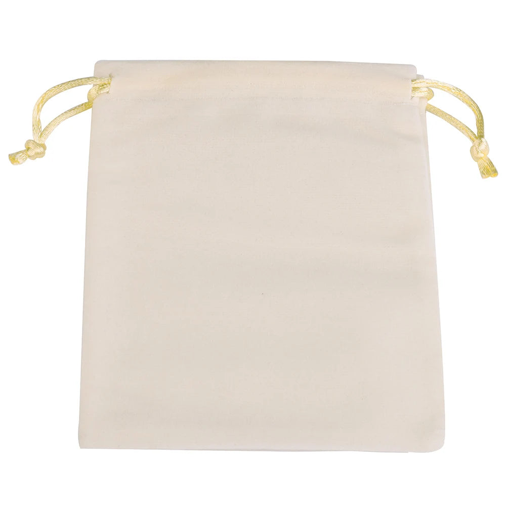 A rectangular, pale cream velvet drawstring gift bag with light yellow ties.