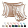 A collection of satin pillowcases in various shades of pink, beige, and green are displayed.