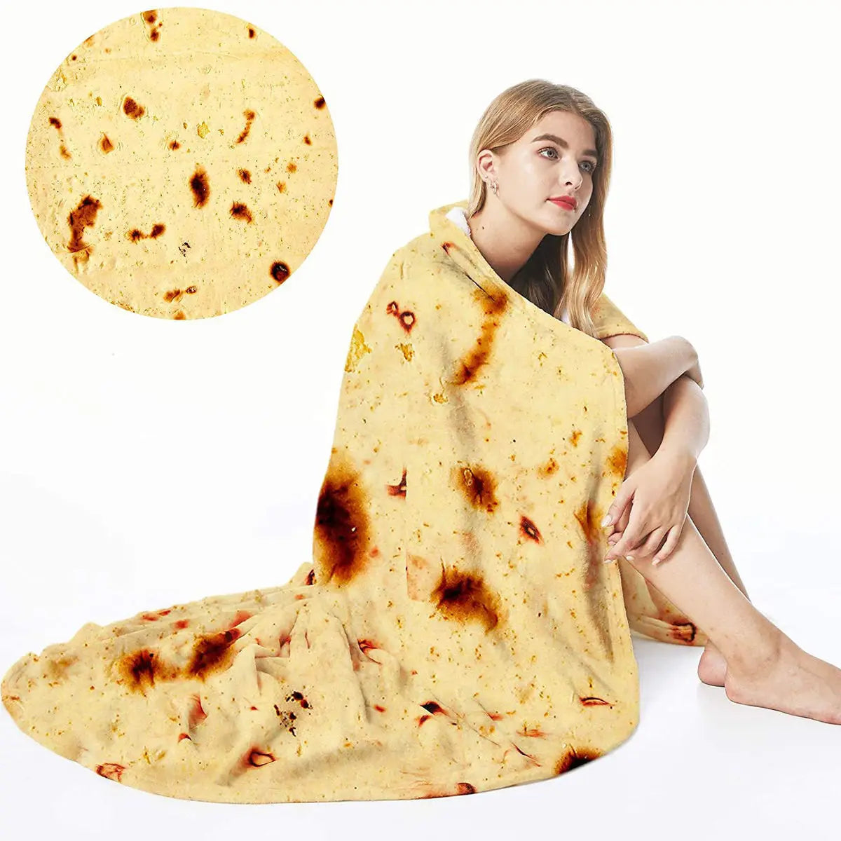 A woman is sitting and wearing a yellow burrito pizza blanket throw.