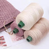 Rolls of 3mm ice rope crochet yarn in pink and beige colors for crafting
