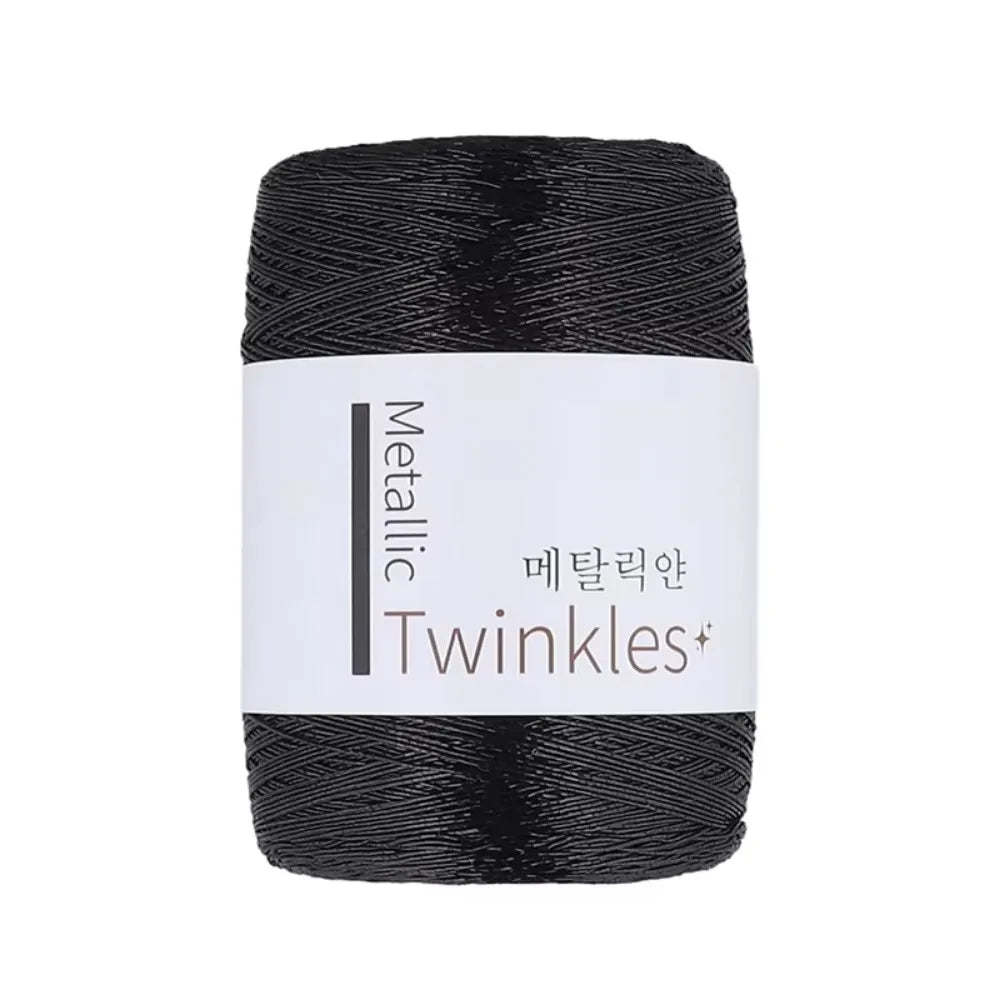 Black metallic Twinkles yarn skein with a white label
