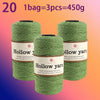Three spools of Hollow yarn, green color, packaged for knitting and crochet projects.