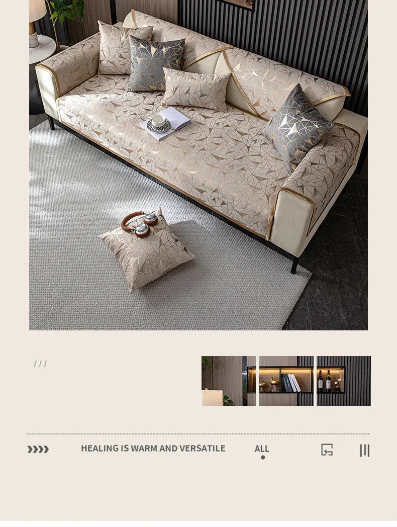 A luxury chenille sofa cover in beige and gray tones with decorative pillows on a modern sofa.