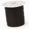 A spool of multicolor elastic beading cord with a white label on top.