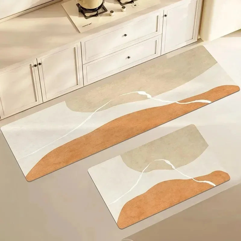 A rectangular kitchen floor mat with beige and terracotta stripes is displayed on a white cabinet surface.