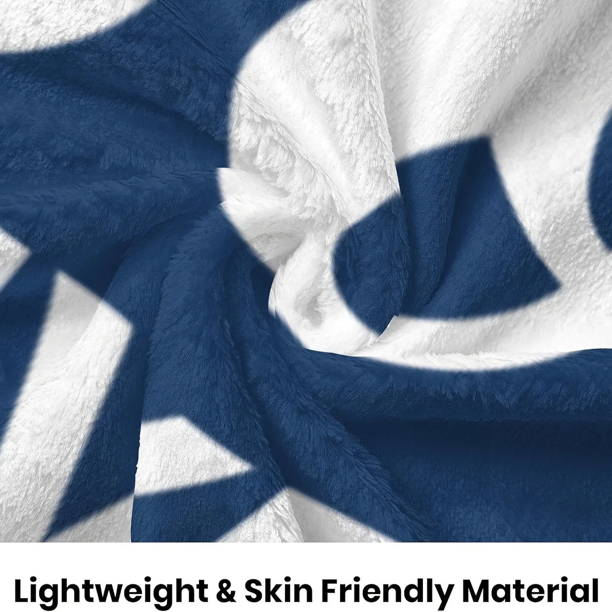 A navy blue and white patterned fleece blanket with a soft, fluffy texture.