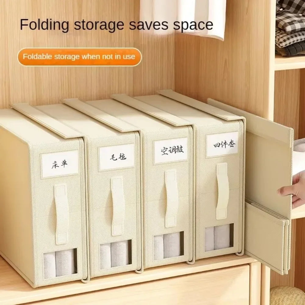 A set of five light beige folding storage boxes for organizing bedding and clothing on a wooden shelf.