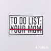 A black embroidery patch with white text that reads TO DO LIST YOUR MOM, featuring a red line under YOUR MOM.