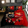 A printed letter bedding set featuring a dark red and black design with gold crowns and roses.