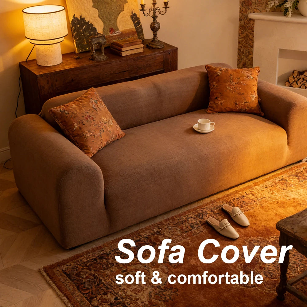 A brown sofa covered with a textured fabric, resting on a rug in a living room setting.