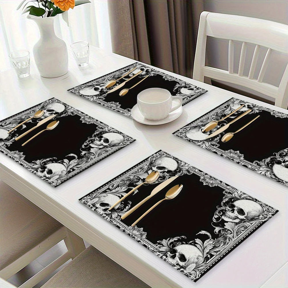 A set of black placemats featuring a vintage skull and floral mystic cross design on a white table.