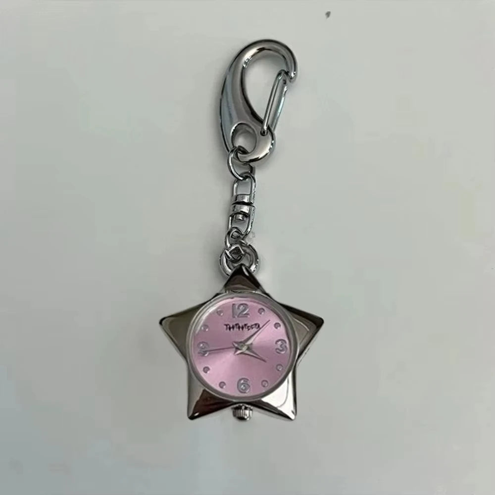 Silver keychain featuring a pink-faced pocket watch with a star-shaped body.