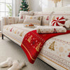 Decorative sofa seat covers featuring a winter holiday pattern on a light-colored sofa.