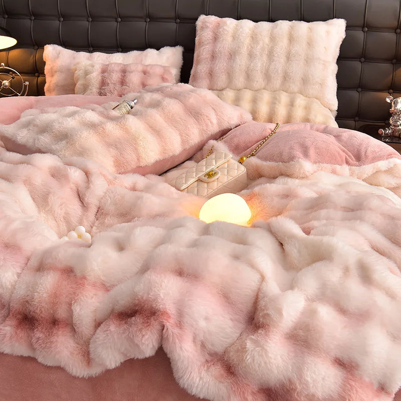 A plush rabbit hair bedding set featuring pink and cream textures on a dark leather headboard.