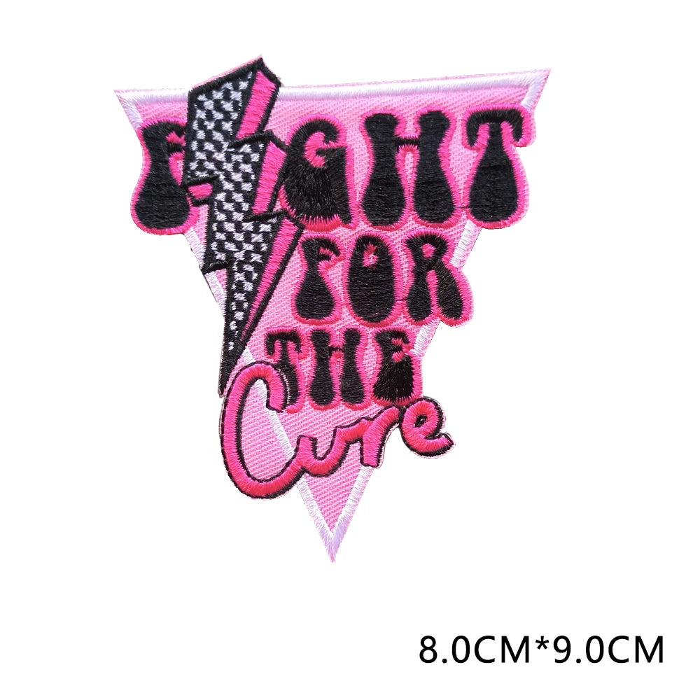 Pink and black embroidered patch with the text FIGHT FOR THE CURE on a lightning bolt design