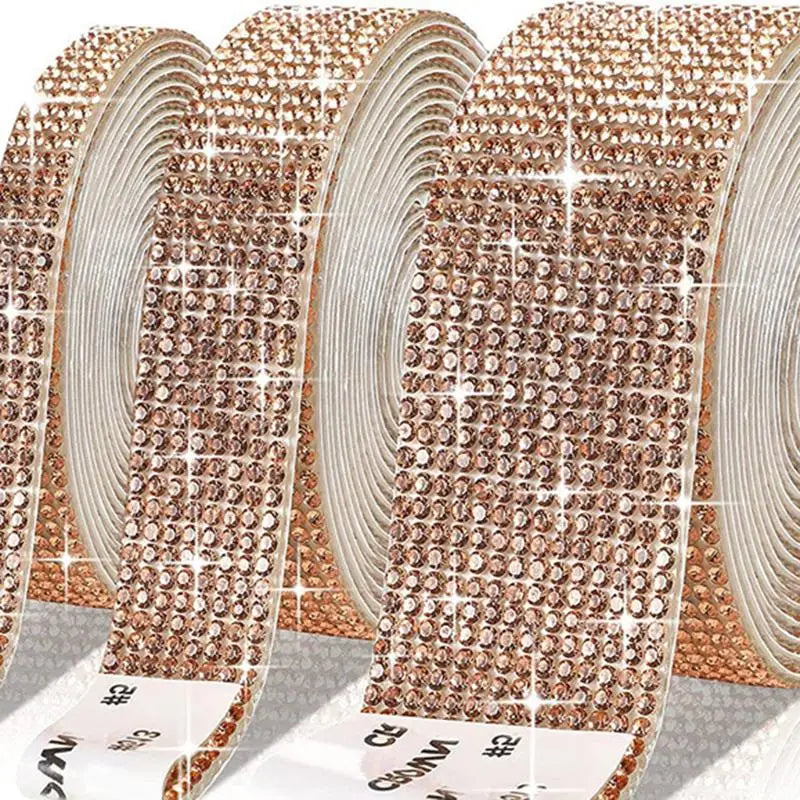 Close-up of rose gold crystal rhinestone sticker ribbon with diamond trim rolled into a decorative strip
