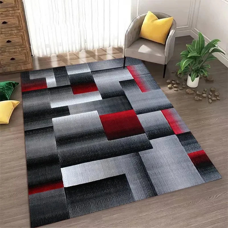 Abstract geometric area rug featuring a pattern of black gray white and red squares on a wooden floor.
