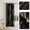Blackout curtains featuring a golden wave pattern hanging on a rod.