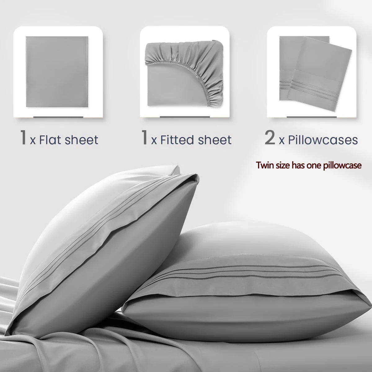 A set of four gray microfiber bed sheets and two pillowcases are displayed on a bed.