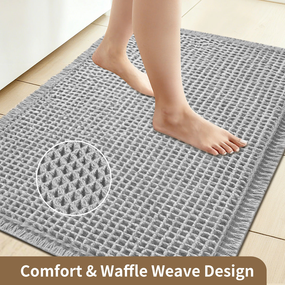 A gray waffle weave bathroom mat with a foot resting on it, showing the comfort and waffle weave design.