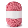 A skein of pink soft milk cotton knitting yarn coiled into a ball.