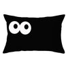 A black pillow cover with two white circular designs on the front.
