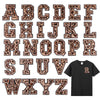 A set of leopard print alphabet iron-on patches in brown and black tones.