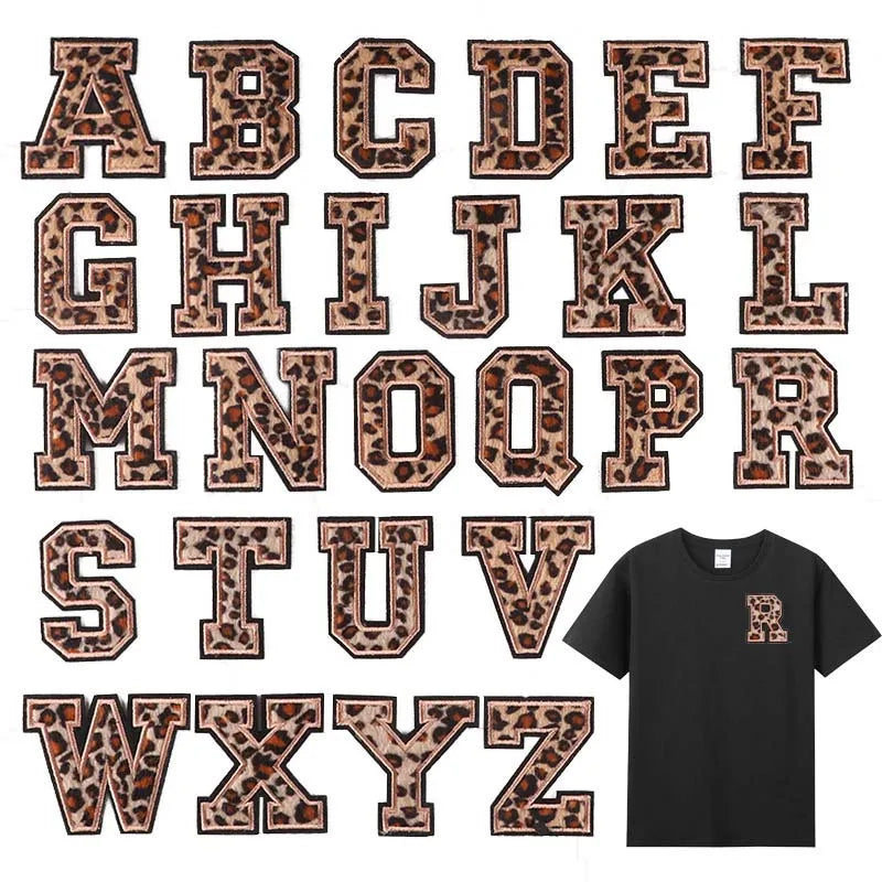 A set of leopard print alphabet iron-on patches in brown and black tones.