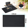 Black heavy-duty double-sided grill mat used for outdoor cooking and grilling.