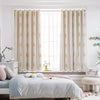 Elegant wheat field embroidered curtains framing a bright window in a light-filled room.