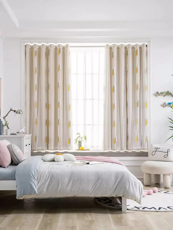 Elegant wheat field embroidered curtains framing a bright window in a light-filled room.