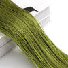 A close-up of a long, bright olive green thread curtain tie-back for doors and windows.