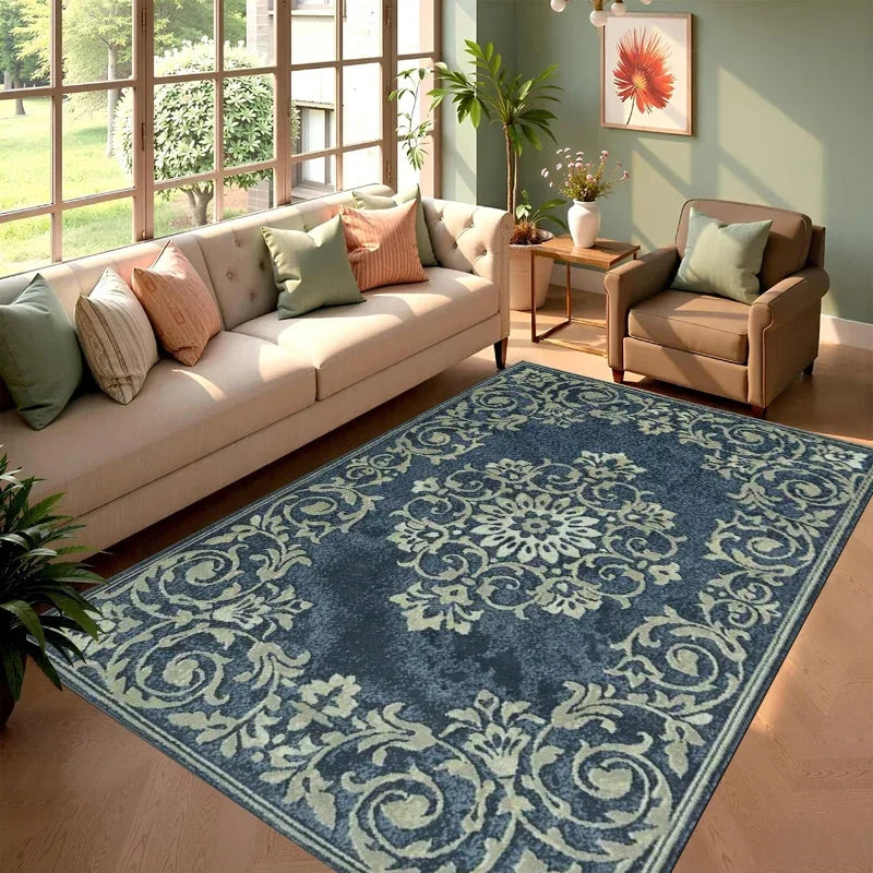 A dark blue and cream patterned cowhide print area rug placed in a bright living room with natural light.