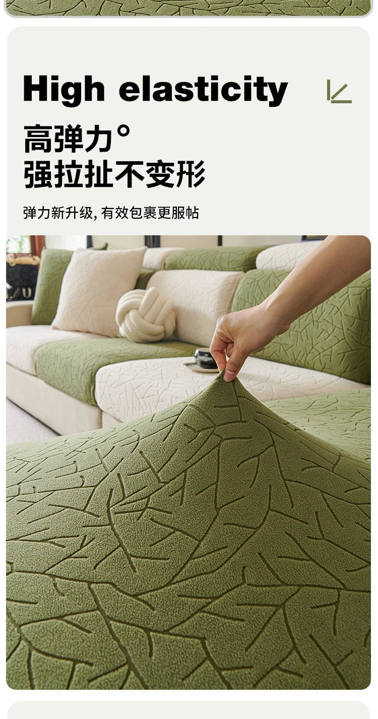 Close-up of a textured olive green jacquard sofa cover fabric showing high elasticity and woven branch patterns.