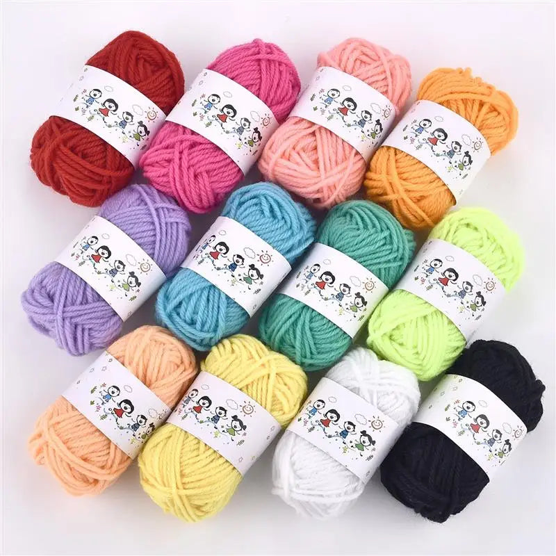 A collection of twelve soft acrylic yarn skeins in various colors including red, pink, orange, yellow, green, and purple.