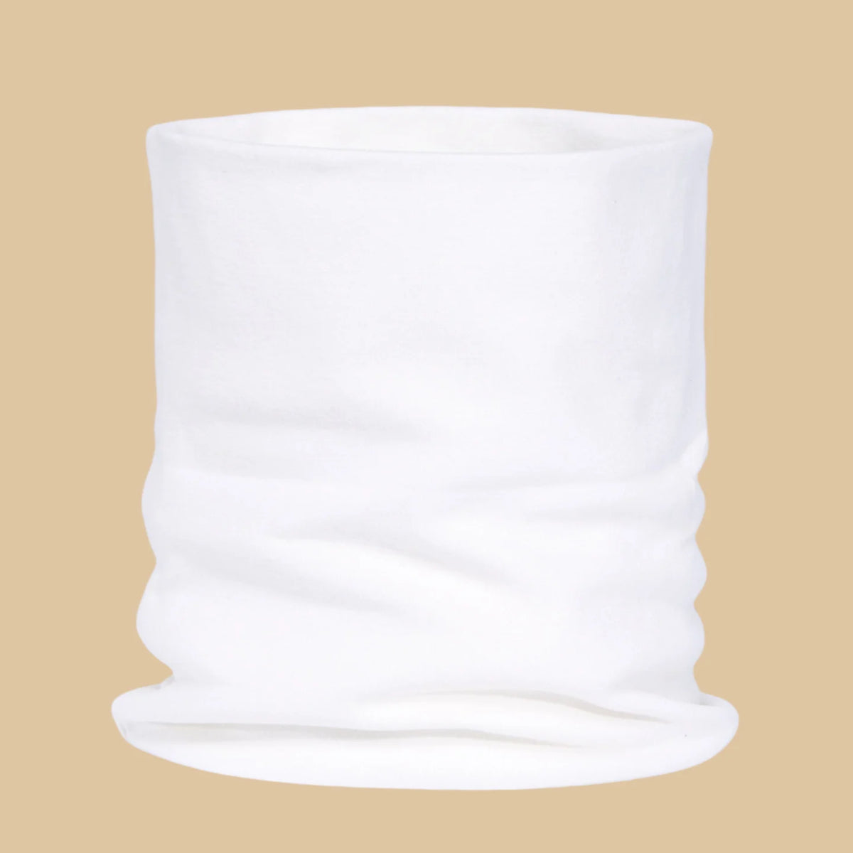 A rolled white soft cotton warm neck scarf displayed against a beige background.