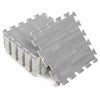 Grey interlocking foam floor mats with wood grain texture stacked and laid out.