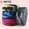 Rolls of camouflage elastic stretch ribbon in various colors for sewing and craft projects
