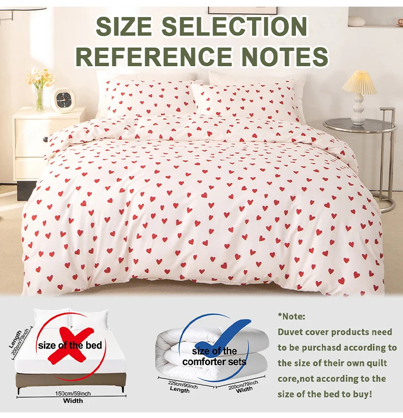 White duvet cover set with a red heart print and pillow cases displayed on a bed.