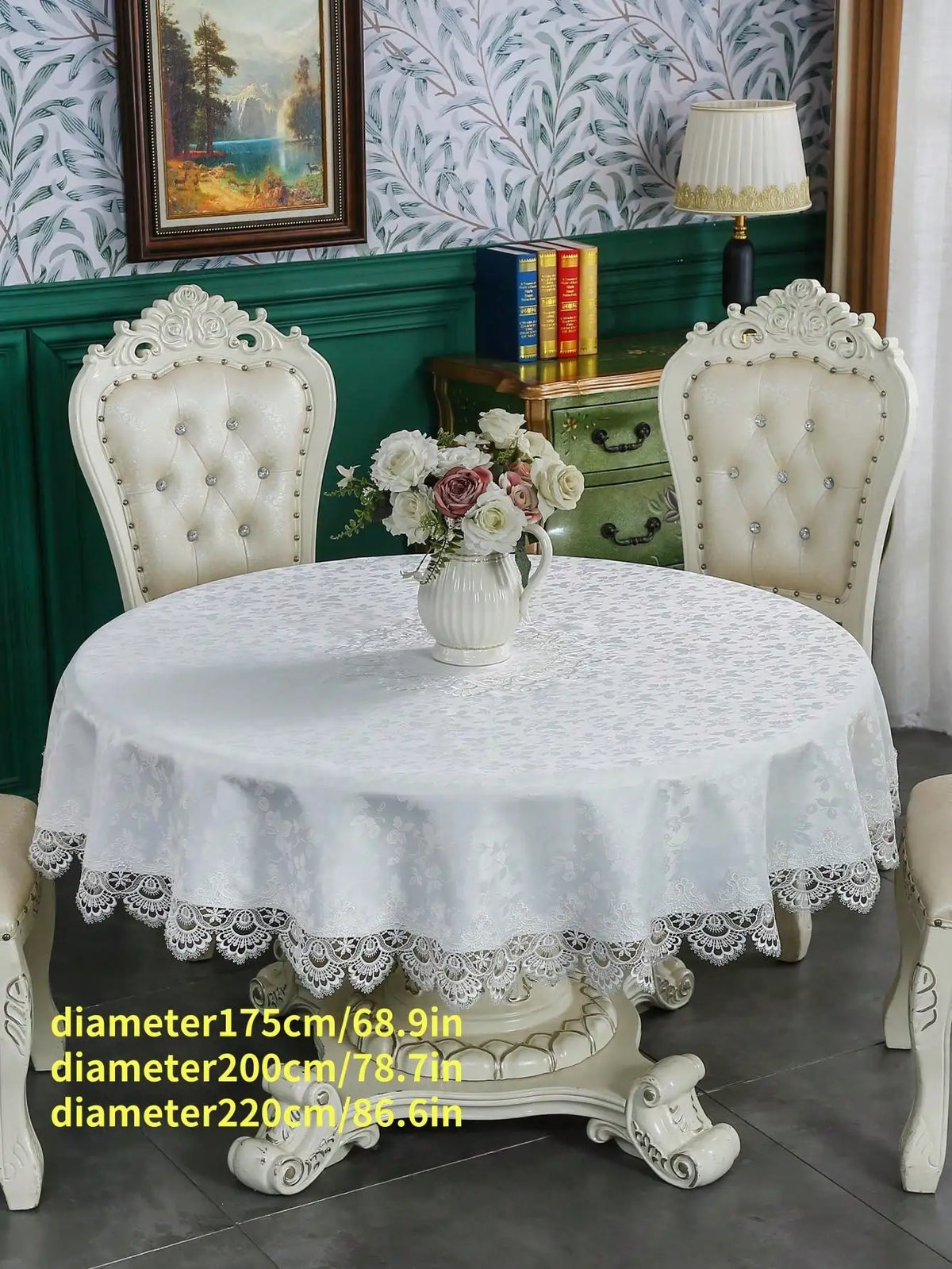 White embroidered lace tablecloth with an elegant scalloped edge displayed on a round table.