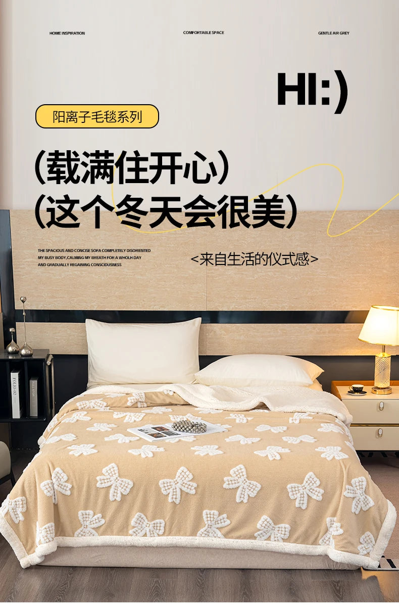 A beige jacquard lambswool blanket is displayed on a bed, suggesting cozy comfort.