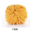 A ball of bright yellow hand-woven chunky chenille yarn.